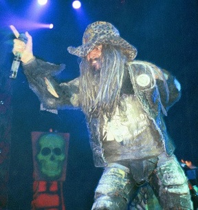 Portrait or other artwork representing [{0a2b668d-a37e-4854-807f-1fd3993f5220 Artist rob-zombie.jpeg} {2ef7dbf0-e6da-4f74-b967-ffe7c61f663b Release hellbilly-deluxe.jpeg} {4c78f2fb-d4e8-419c-a5e6-3b5eb8d7490c Release summer-2001.jpeg} {5970c9b4-c749-4cca-ad16-3ddd444da53a Release bang-your-head.jpeg}]