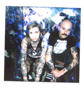 Portrait or other artwork representing [{3281a700-ec6f-4696-960e-2daaa6015c7f Artist youth-code-2.jpeg} {3281a700-ec6f-4696-960e-2daaa6015c7f Artist youth-code-3.jpeg} {3281a700-ec6f-4696-960e-2daaa6015c7f Artist youth-code-4.jpeg} {3281a700-ec6f-4696-960e-2daaa6015c7f Artist youth-code.jpeg} {70193281-d68c-44d5-918c-38a62d9bfc92 Release a-place-to-stand.jpeg} {724f7eef-03cc-426d-ad5f-f54d841f55cc Release yours-with-malice.jpeg} {76930d25-7370-4fc1-abd2-4554e52fd5b0 Release a-skeleton-key-in-the-doors-of-depression.jpeg} {c6be1240-ffc5-4cef-8b2b-118a8b1f1dd4 Release commitment-to-complications.jpeg}]