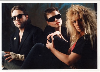 Portrait or other artwork representing [{11e817a3-3890-4717-b32c-aae1284b44cb Release voodoo-u.jpeg} {e637a00f-525e-4afd-b115-256587d2eff5 Artist lords-of-acid.jpeg}]